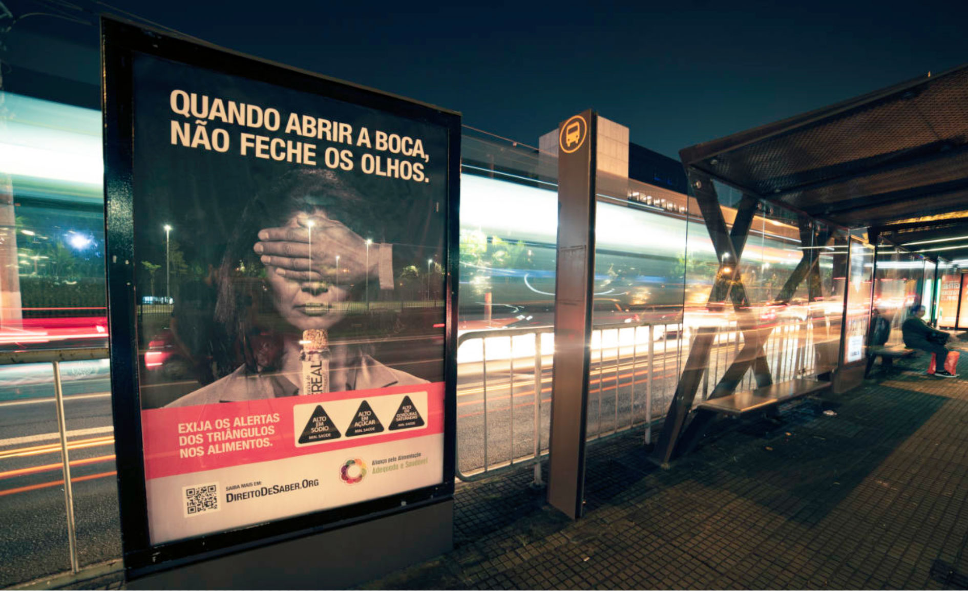 Out-of-home ad at a bus station in São Paulo with the text, “When you open your mouth, don’t close your eyes.” Source: Idec