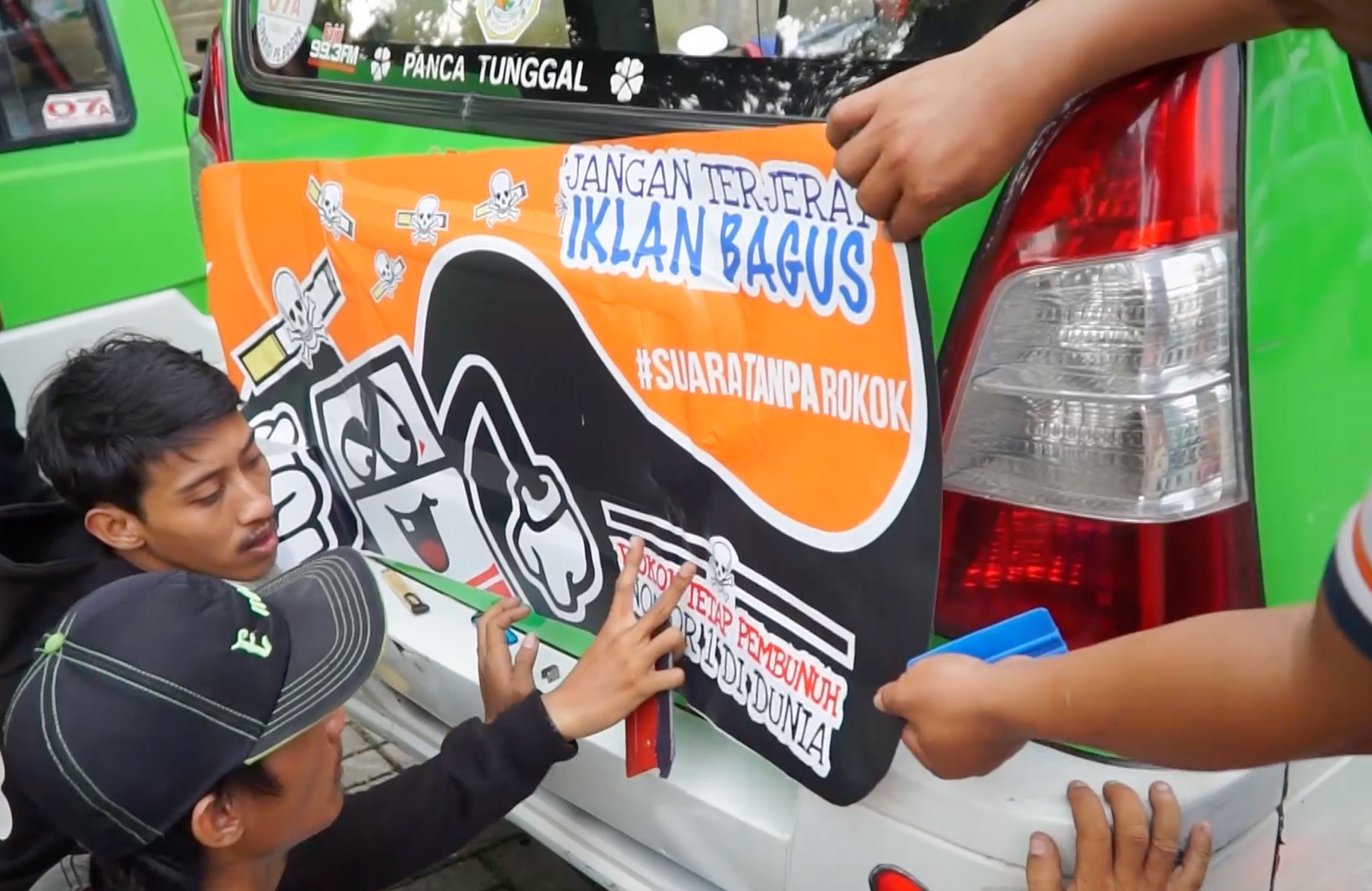 Artists and drivers posted tobacco harm messages on to minibuses in Bogor, Indonesia (World No Tobacco Day, 2017) as part of the #SuaraTanpaRokok (Voices Without Cigarettes) campaign to enforce smoke free public transportation.